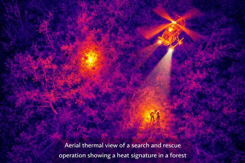 Aerial thermal view of a search and rescue operation showing a heat signature in a forest
